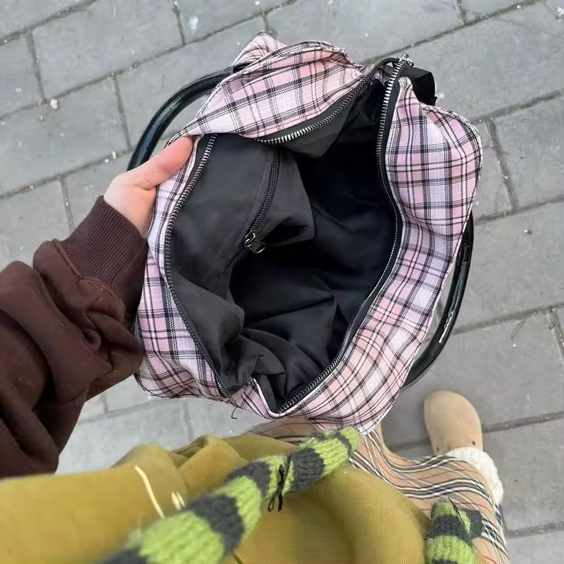 Model carrying the bag, styled with a Y2K-inspired outfit.