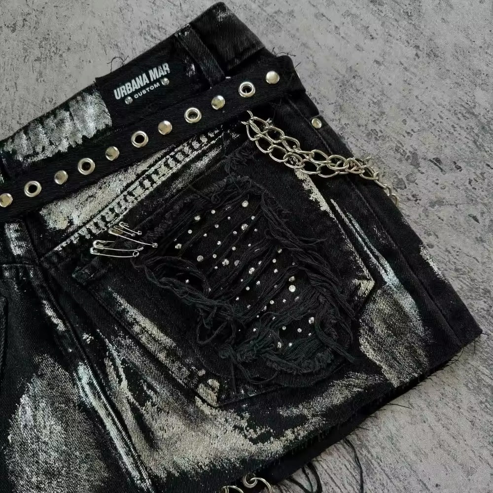Women's black denim mini with chains, rhinestone stars and edgy punk accents