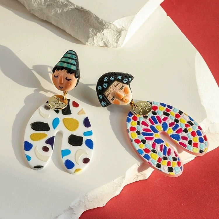 Bold asymmetrical earrings with colorful Indian cartoon faces, perfect for Y2K aesthetic streetwear and cultural style
