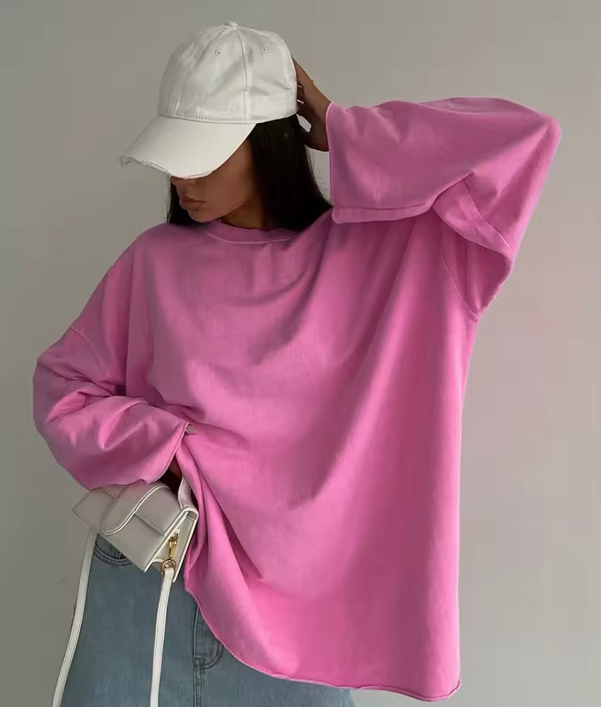 Basic pink long sleeve tee on model styled with white jeans