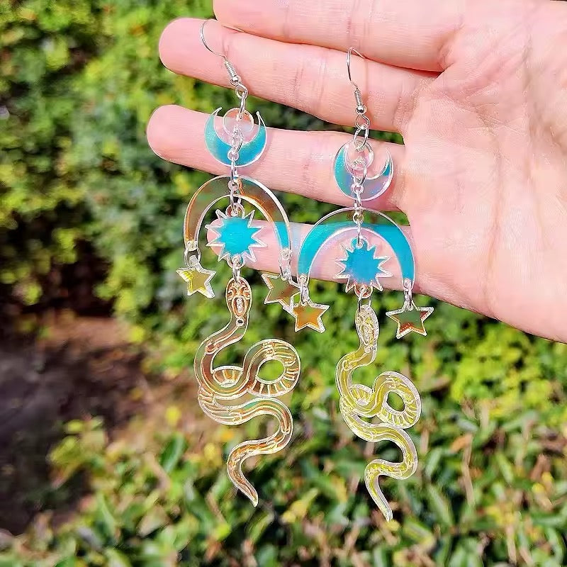 Mystical snake earrings with moon symbol, handmade aesthetic jewelry with iridescent acrylic perfect for spiritual outfits