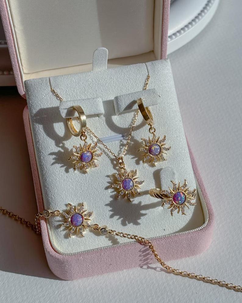 Close-up of Rapunzel-inspired opal sun pendant necklace with intricate zircon details.
