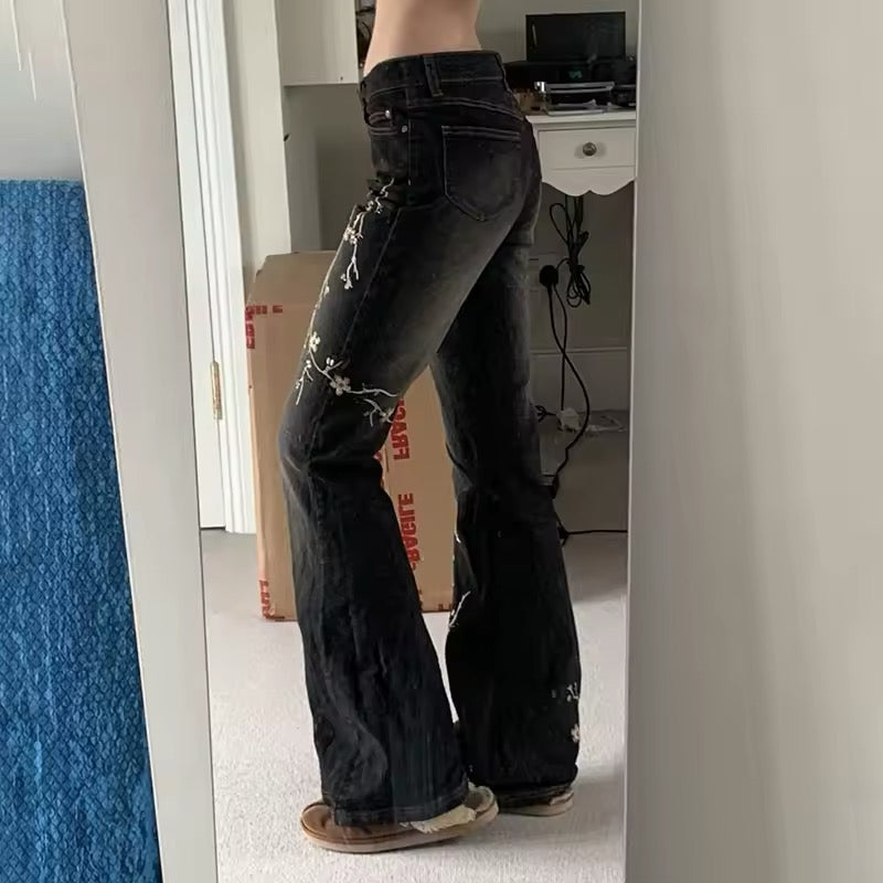 Baggy embroidered jeans paired with streetwear sneakers