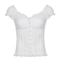 White coquette crop top with floral texture and romantic button detail
