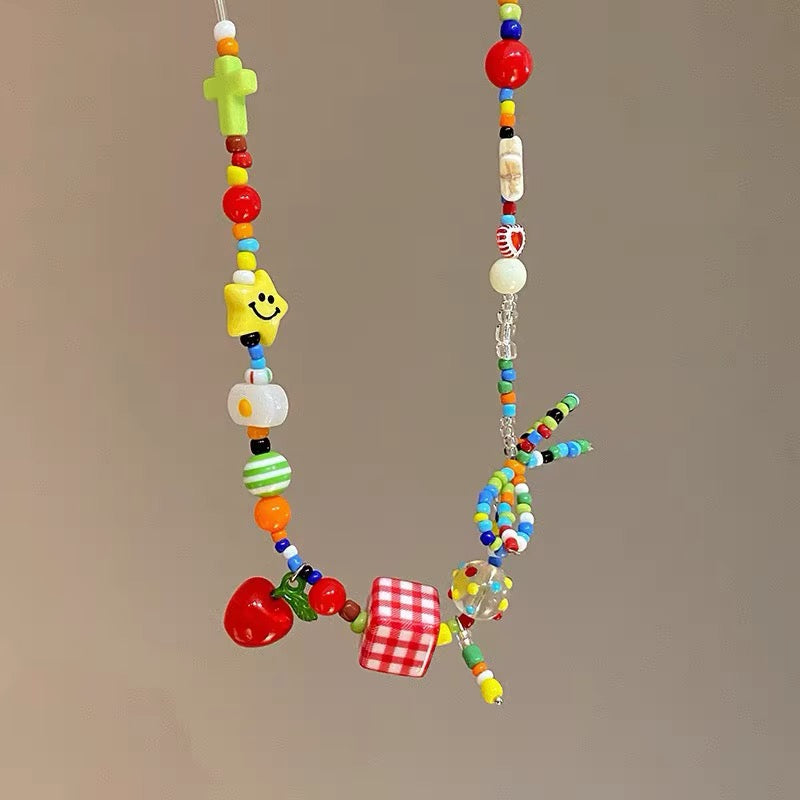 Y2K fruit bow colorful necklace featuring cute cartoon fruit charms, pastel beads, and star pendants for Harajuku, EMO, and egirl aesthetic outfits