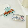Funny goldfish hair clip with a playful acetate finish