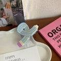 Durable acetate pencil hair claw with a playful aesthetic