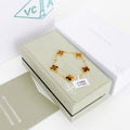 Gemstone charm bracelet with brown clover in gold setting