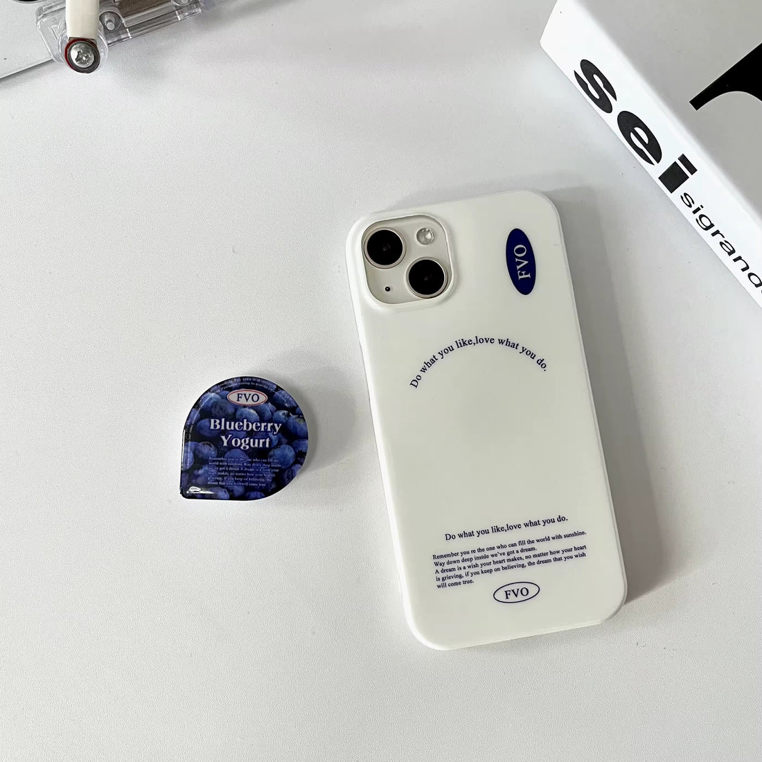Blueberry iPhone case with glossy finish and built-in stand