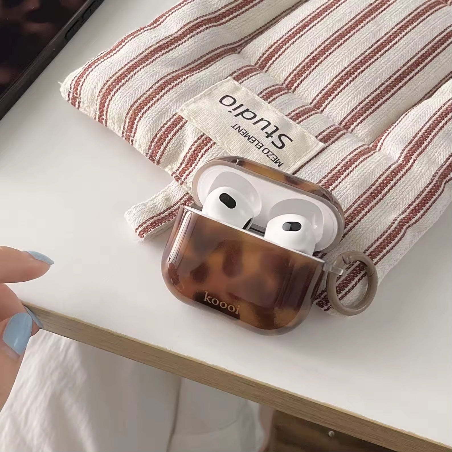 Retro aesthetic amber AirPods cover on white background