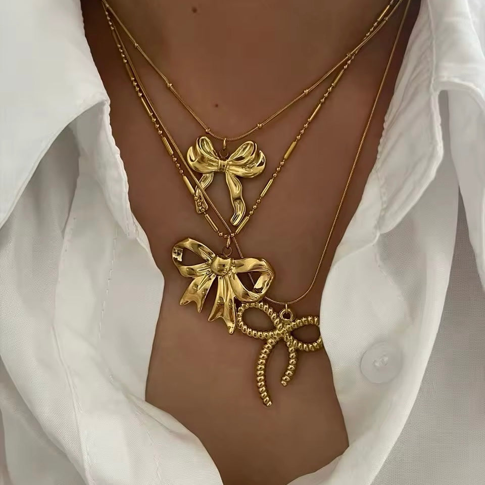 Stylish and trendy coquette aesthetic gold bow pendant necklace