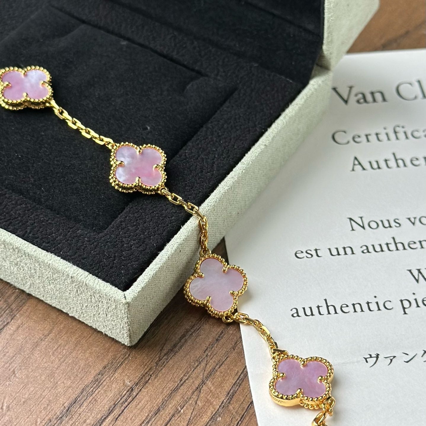 Elegant gold clover bracelet with multicolor charms and 18K finish