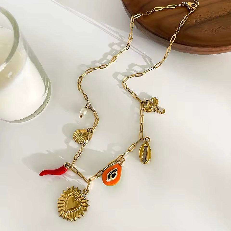 Chic and stylish red enamel pepper and shell charm necklace