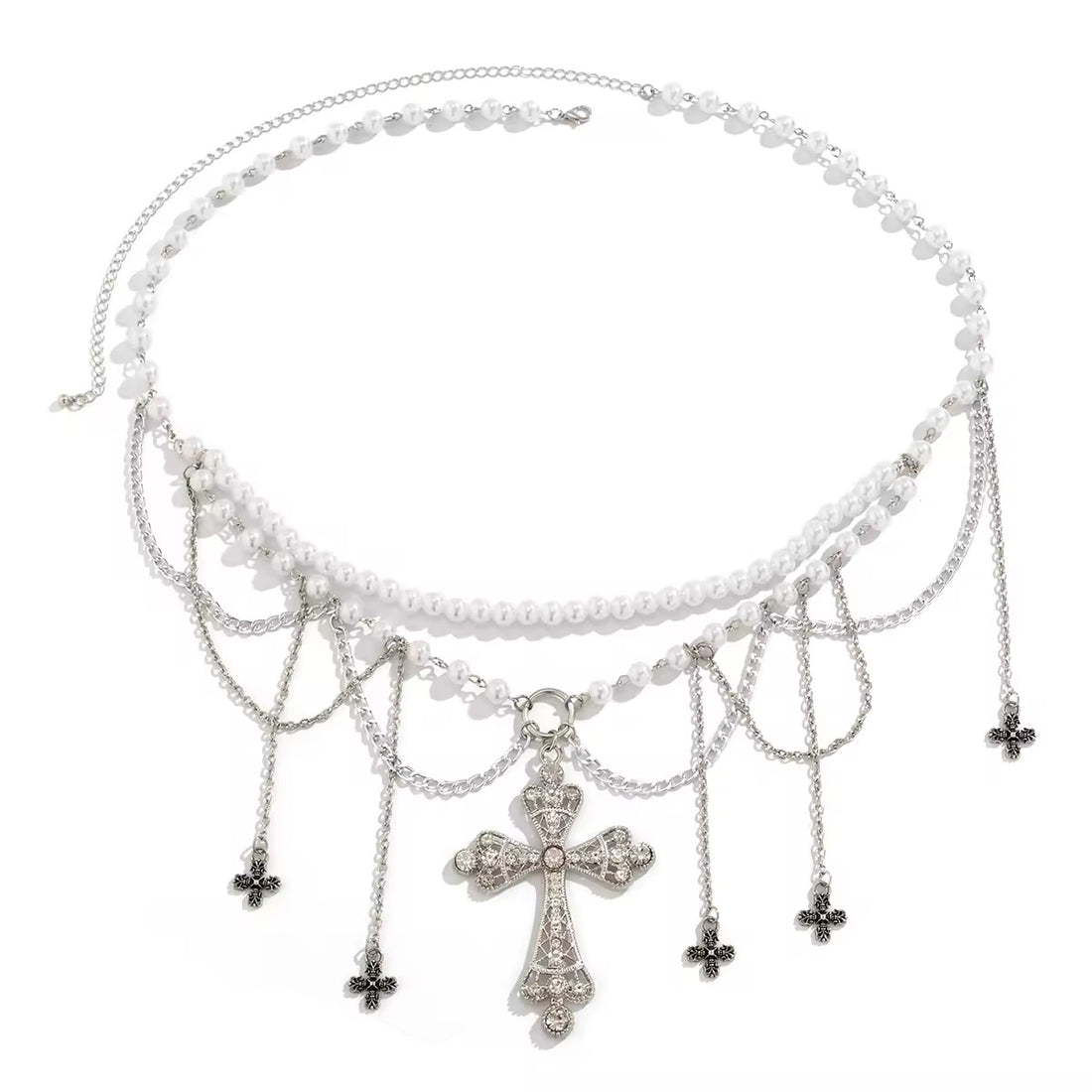 Gothic pearl belly chain with cross charm and tassels, worn over black mini skirt