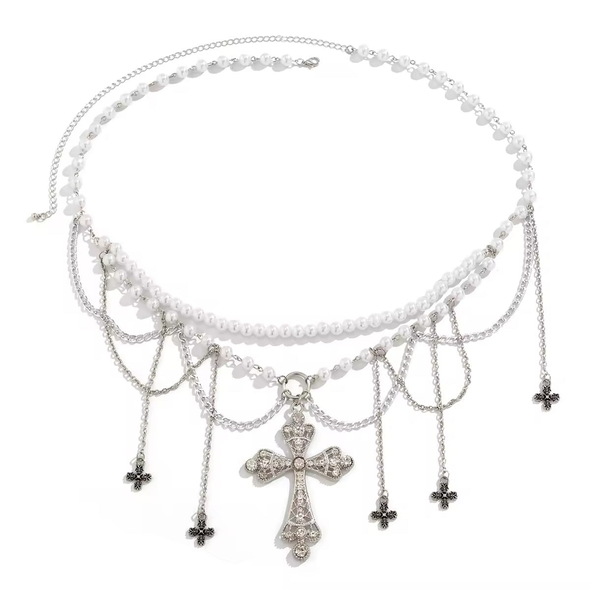 Gothic pearl belly chain with cross charm and tassels, worn over black mini skirt