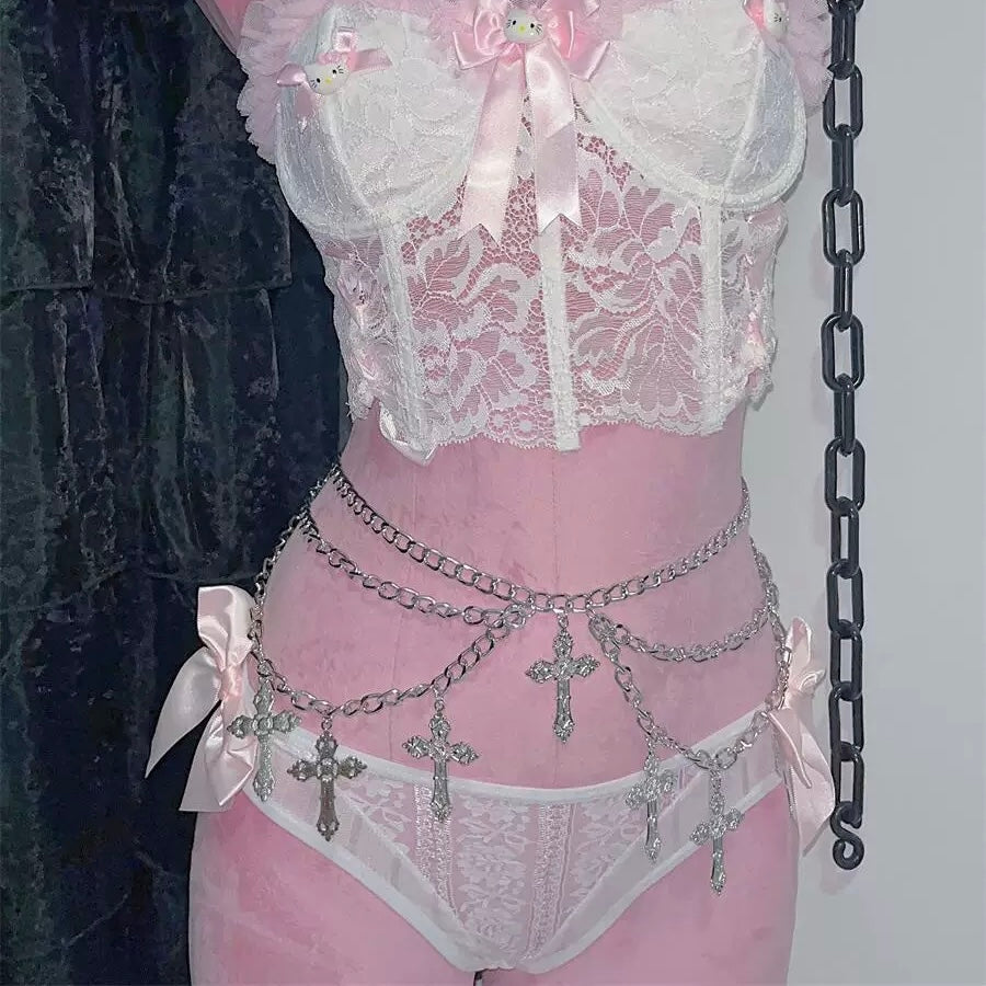 Gothic cross chain belt with silver metal layers over jeans