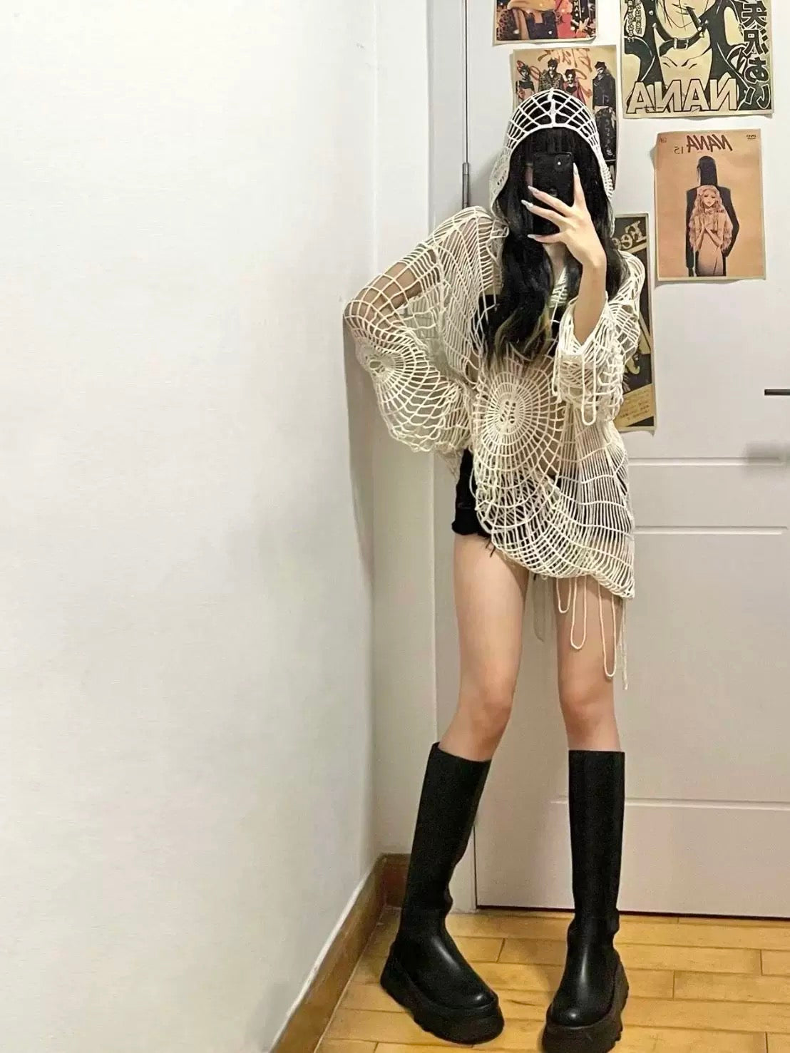 Black knit sweater with open-hole spider web pattern, genderless streetwear piece for grunge Korean fashion aesthetics