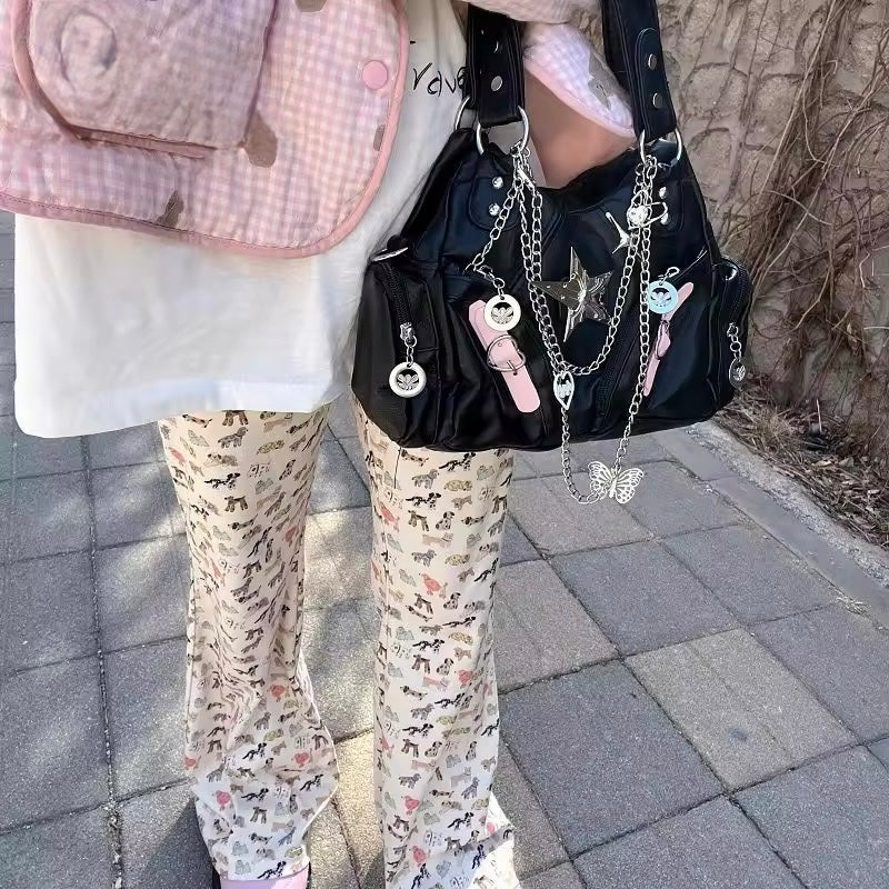 Close-up of silver star and padlock details on spicy girl crossbody bag