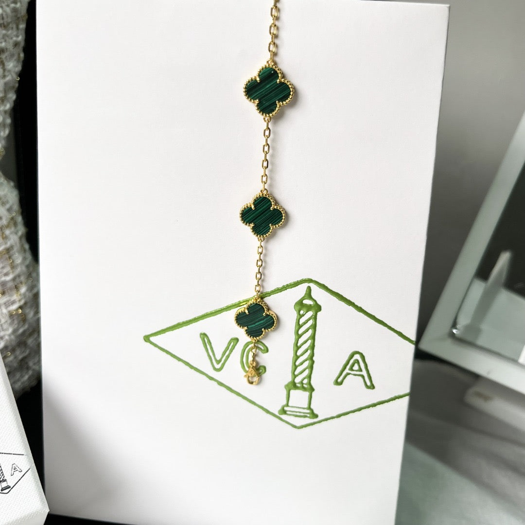Green clover bracelet with 18K gold plating and enamel detail
