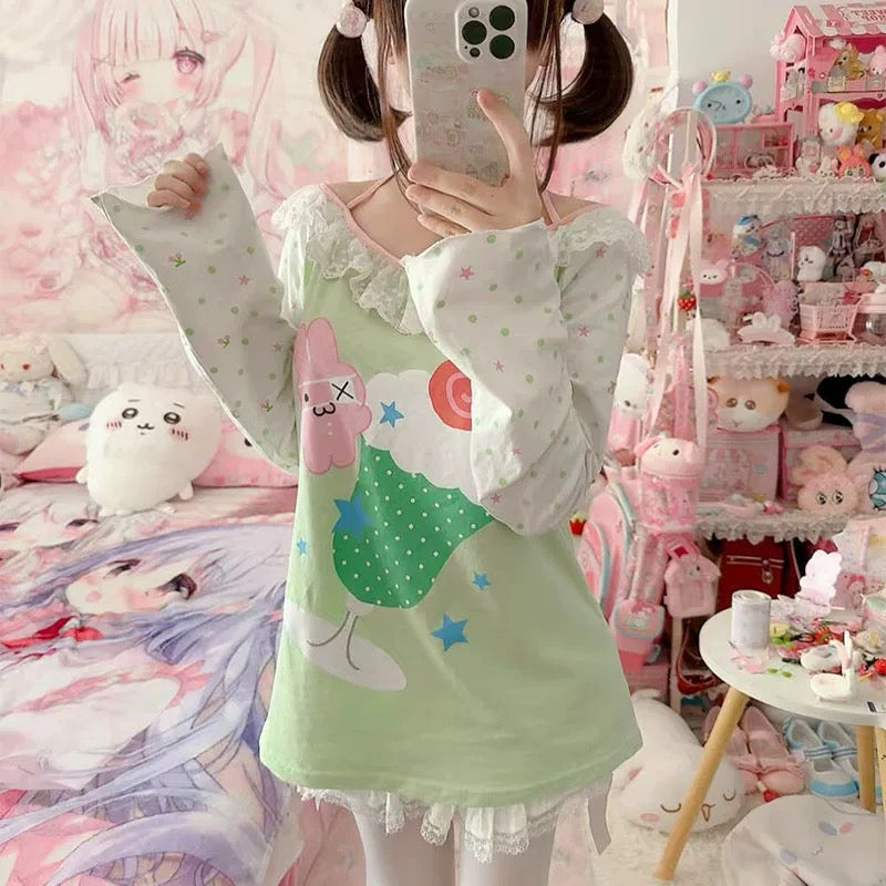 Close-up of the cute cartoon print on a pastel green shirt