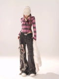 Back view displaying the high-rise waist and relaxed silhouette of the grunge aesthetic jeans.