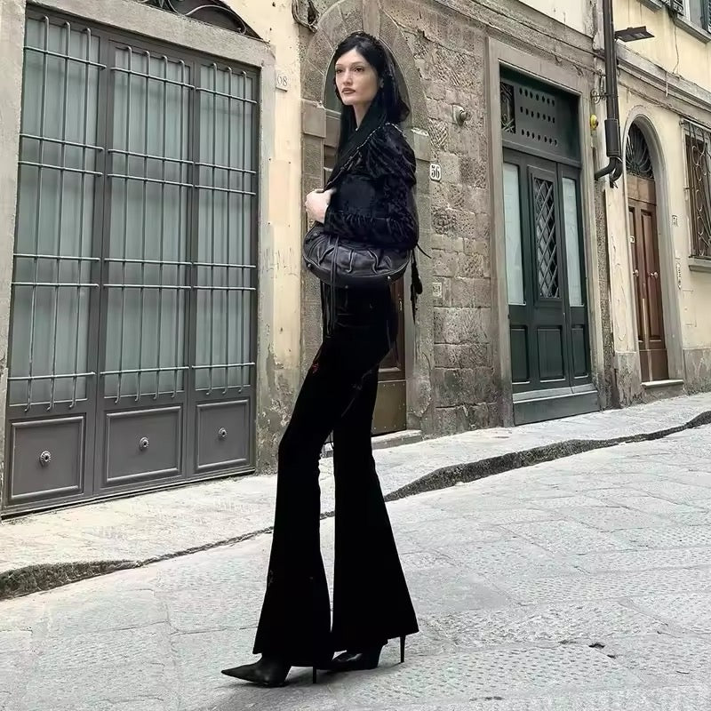 Gothic cross flared pants, dark velvet high-waisted trousers with embroidery, Y2K streetwear aesthetic for Mall Goth, punk grunge, and Harajuku fashion