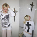 White gothic long sleeve shirt featuring “My Vibe So Strong” text and cross design