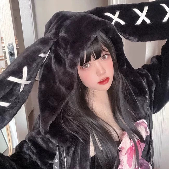 Harajuku girl wearing black bunny ear fur hoodie in y2k style