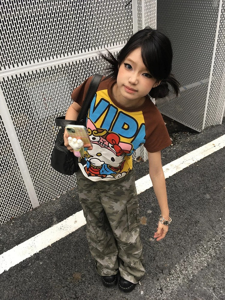 Lifestyle image of the tee paired with yellow sneakers and accessories for a festival outfit.