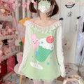 Back view of Harajuku style oversized tee in green with cartoon design