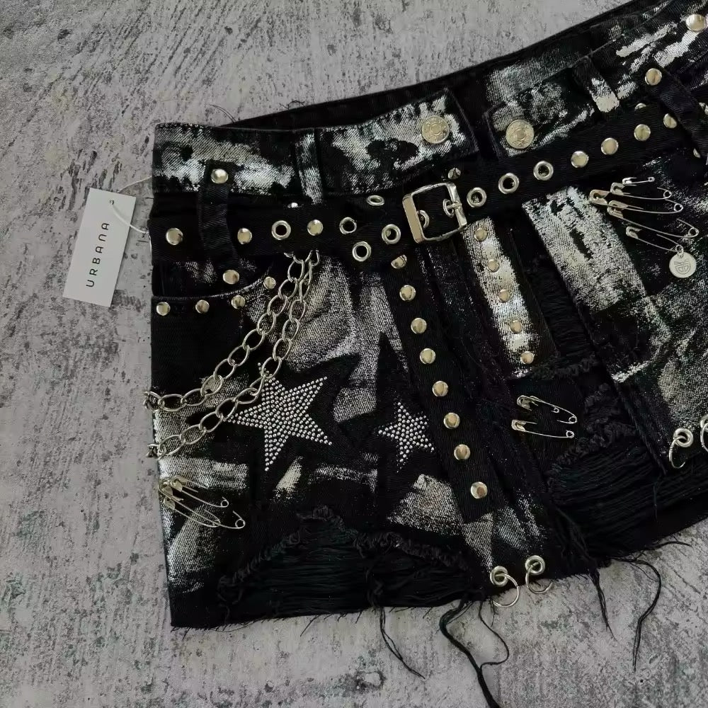 Washed black denim skirt with low waist fit, star embroidery and punk elements