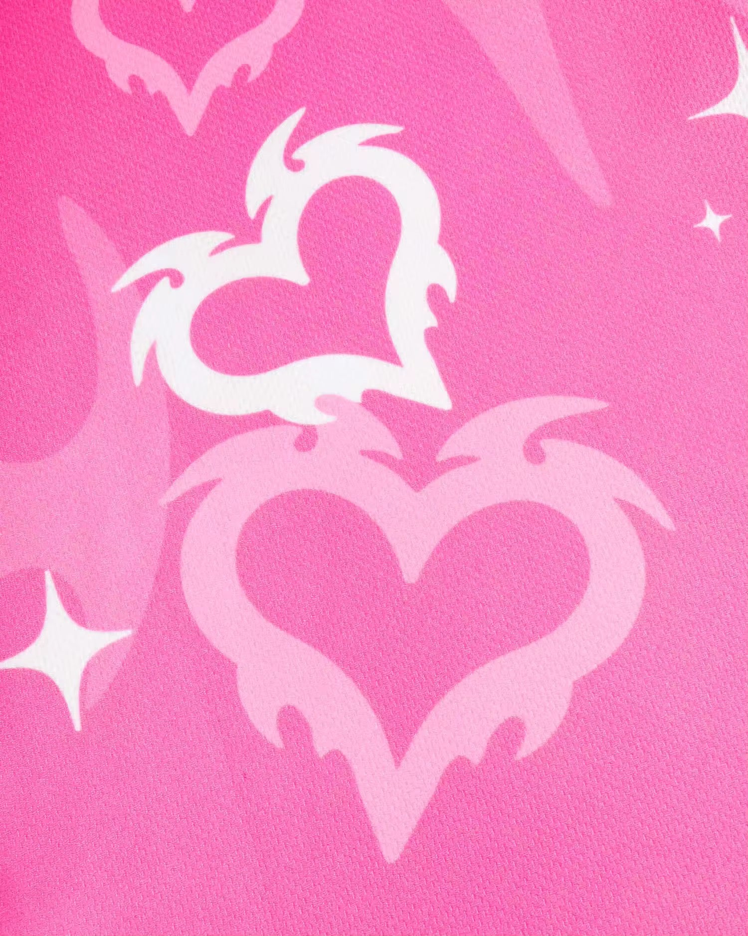 Front view of the Playblonde graphic shirt with symmetrical pink-white love flames.