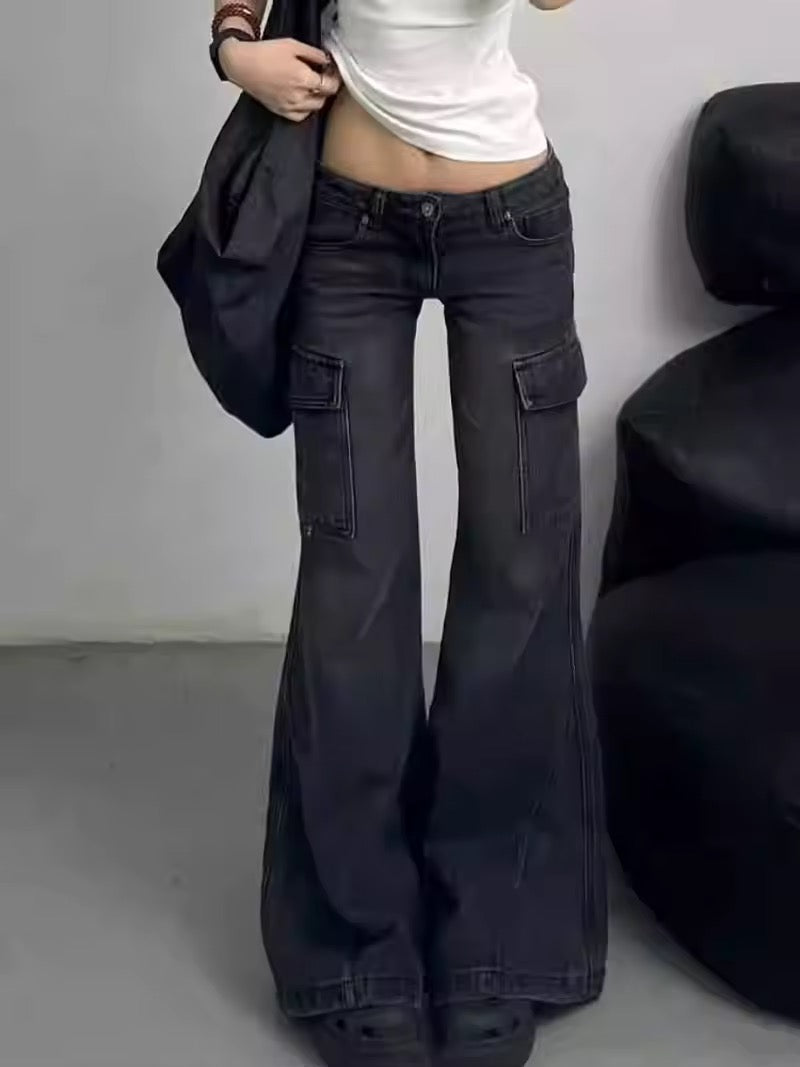 Front view of high-waisted black flared jeans showcasing wide-leg design and multiple pockets.