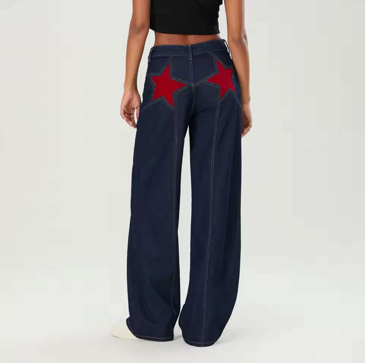 Vintage Y2K-inspired star print denim, loose-fit baggy jeans with Harajuku streetwear aesthetic, perfect for casual and trendy street fashion looks
