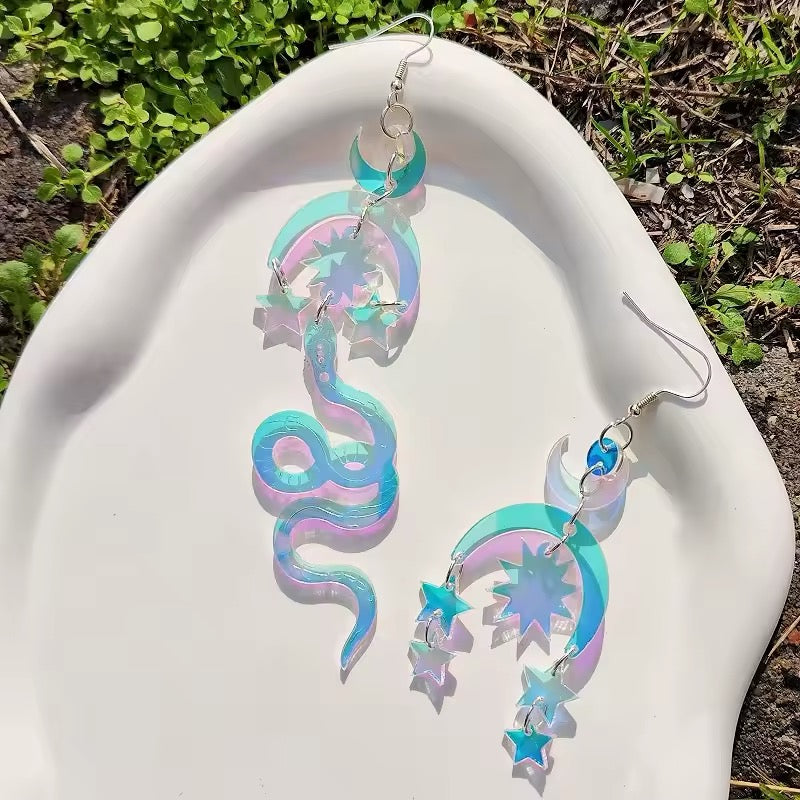 Moon snake earrings made of iridescent acrylic with laser-cut design, combining mystical symbolism and witchy celestial fashion