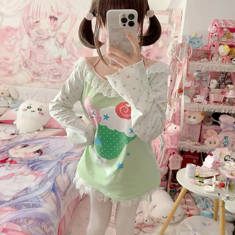 Front view of green kawaii cartoon graphic tee with pastel print