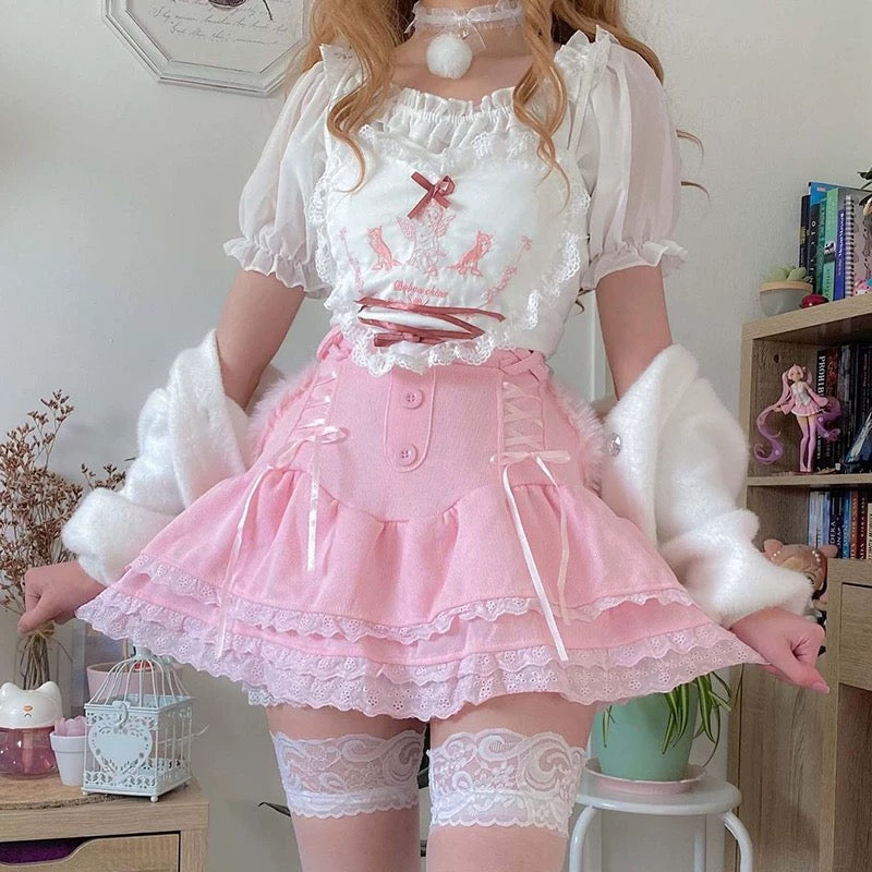 Pink kawaii Lolita mini skirt with lace detail and built-in shorts