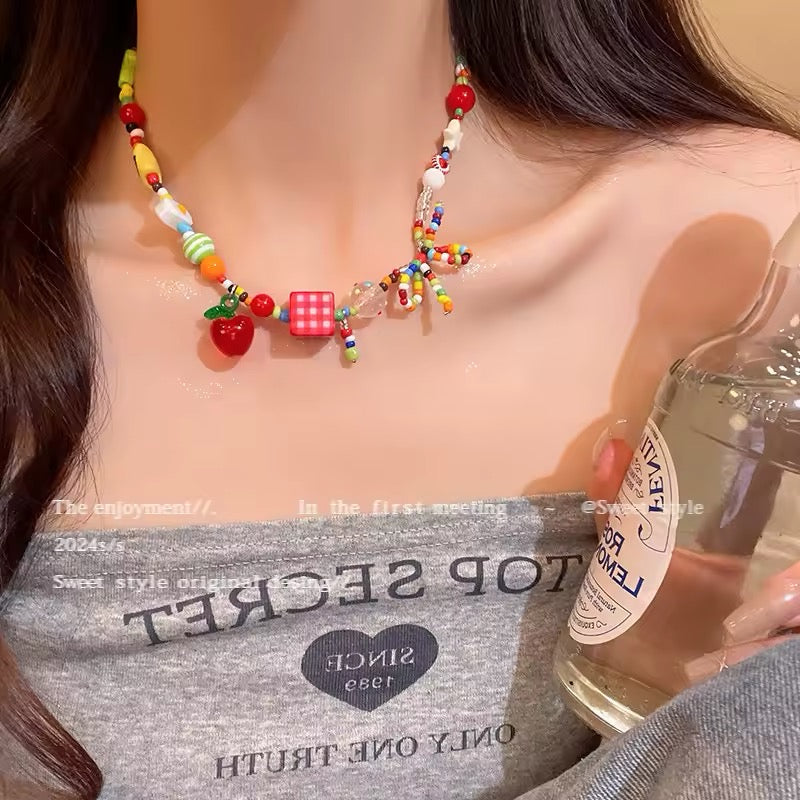 Vintage Y2K-style choker necklace with resin fruit beads, heart charms, and pastel accents for Harajuku streetwear fashion