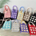 Knitted kawaii heart crossbody bag in red with adjustable strap