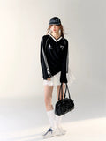 Playful streetwear look featuring white jersey top with girly details.