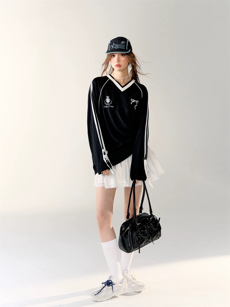 Playful streetwear look featuring white jersey top with girly details.