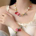 Y2K egirl necklace with cartoon fruit, star, and bow charms, colorful beaded choker for kawaii dopamine jewelry fashion looks