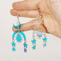 Vintage-inspired holographic snake earrings with moon accents, perfect for alternative fashion lovers and magical accessorizing