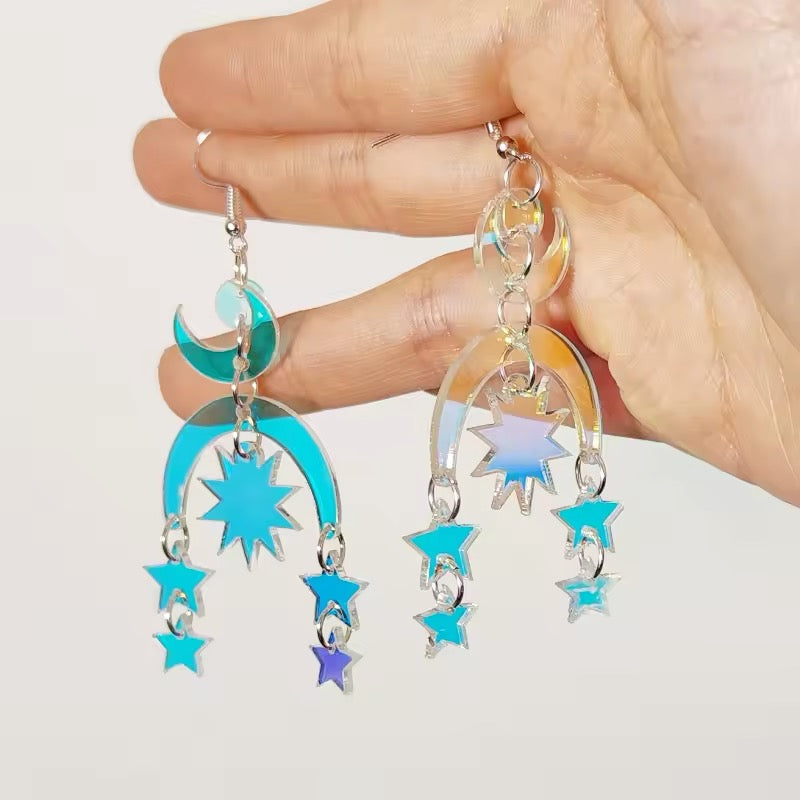 Vintage-inspired holographic snake earrings with moon accents, perfect for alternative fashion lovers and magical accessorizing