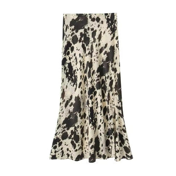 Front view of the leopard print satin midi skirt showcasing its high-waist design and flowing silhouette.
