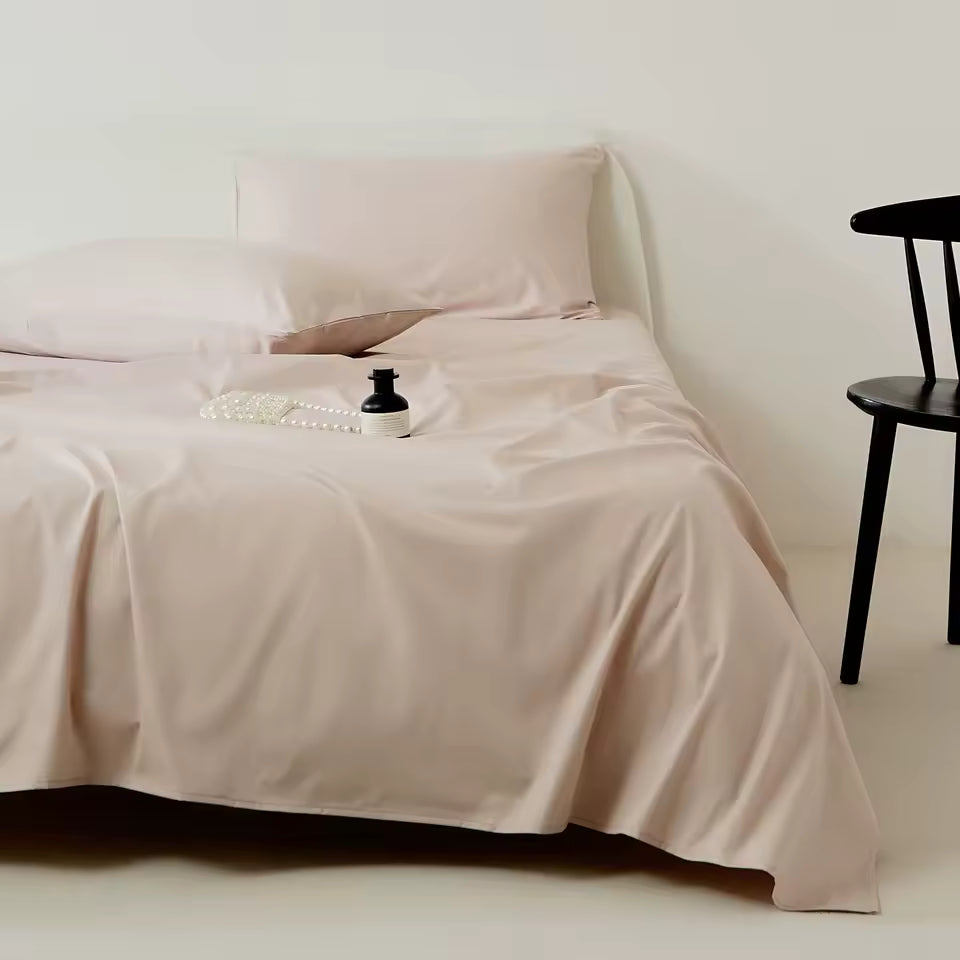 Beige bedspread on a bed with a minimal background