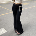 Harajuku-inspired Y2K lace patchwork bootcut pants, low-waisted flared trousers with delicate lace trim, contrast bows, and a trendy streetwear aesthetic