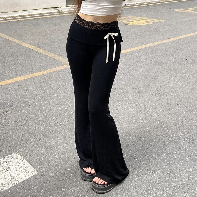 Harajuku-inspired Y2K lace patchwork bootcut pants, low-waisted flared trousers with delicate lace trim, contrast bows, and a trendy streetwear aesthetic