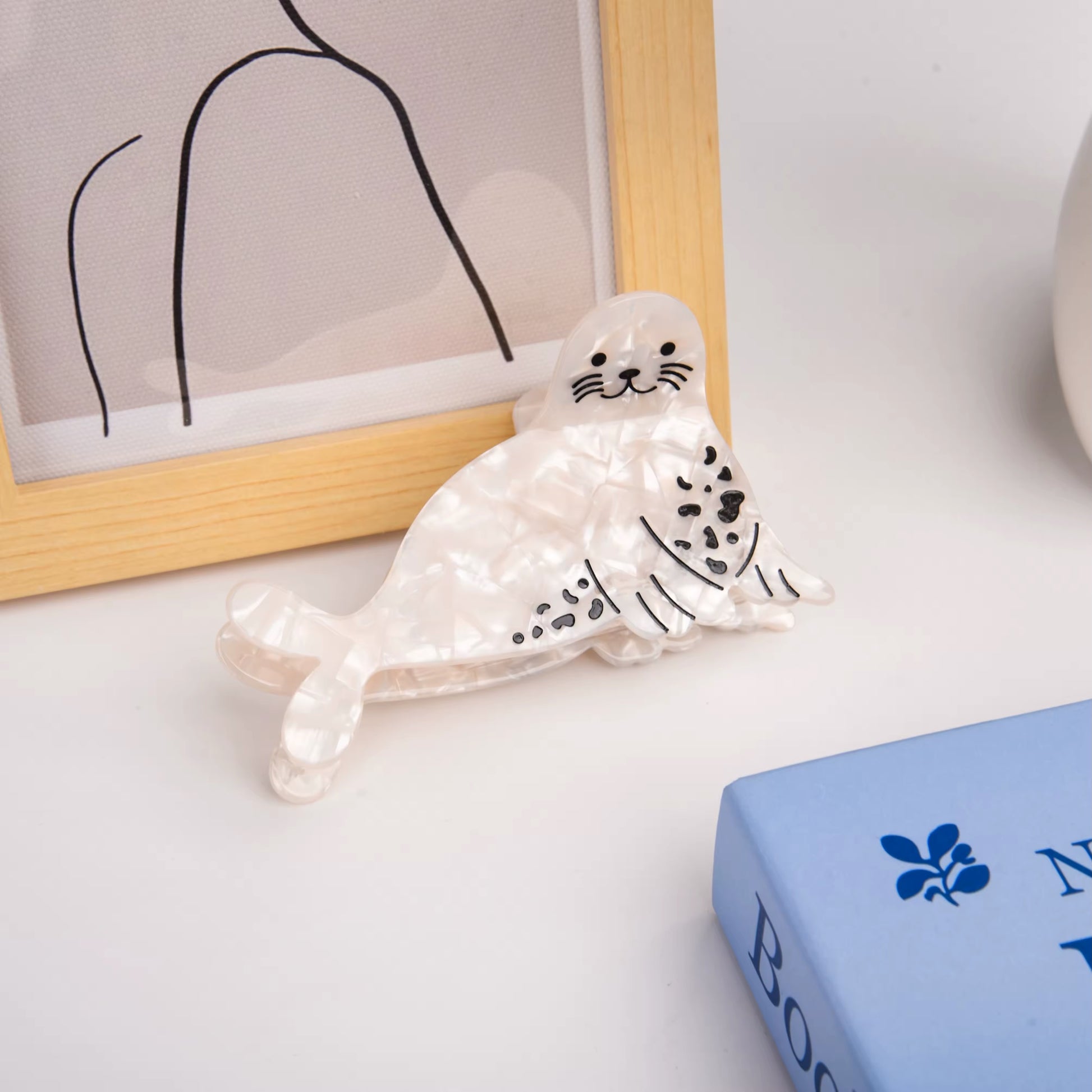 Ocean-themed acetate hair clip featuring a sea lion shape