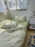 Bedroom with a bed and nightstand near a window